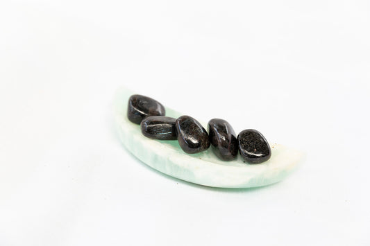 Set of black stones on a white background