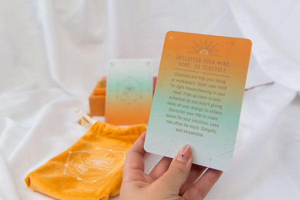 Hand holding a card from Awakening Intuition Oracle Card Deck from Clarity Co. NZ Onlilne Crystal Shop