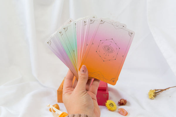 Hand holding the Awakening Intuition Oracle Card Deck from Clarity Co. NZ Onlilne Crystal Shop