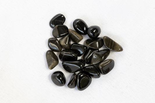 Collection of black stones on a white background