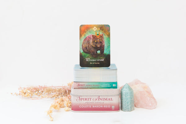 The Spirit Animal Pocket Oracle Deck next to amazonite and rose quartz crystals